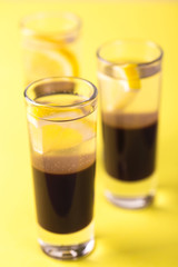Alcoholic cocktail silver bullet with gin, coffee liqueur and lemon.