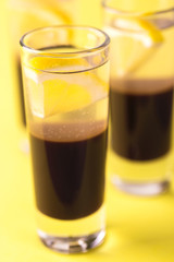 Alcoholic cocktail silver bullet with gin, coffee liqueur and lemon.