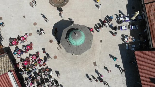 Sebilj square in Sarajevo with people walking aerial shoot 