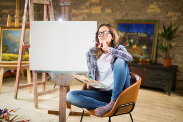Young and beautiful female painter