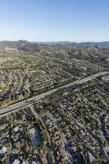 Vertical aerial view of suburban residential neighborhoods near Route 23 freeway in Thousand Oaks, California.  