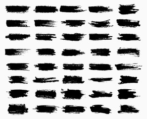 Horizontal black ink scratches or brush watercolor