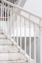 Fototapeta premium Beautiful Marble staircase with white railing leading upwards