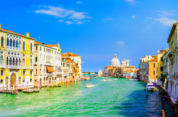 Gorgeous view of the Grand Canal and Basilica Santa Maria della Salute during sunset with interesting clouds, Venice, Italy