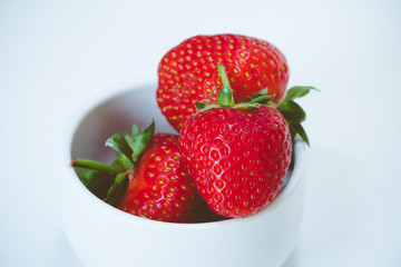 A bowl of juicy, ripe strawberries (Fragaria × ananassa)