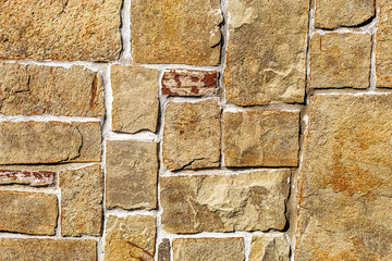 The texture of natural stone Sandstone. The material of natural origin is used for cladding facades...