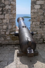 Fototapeta na wymiar Cannon pointing out to sea, Hvar, Croatia.