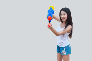 Asian sexy woman with water in hand on white background,Festival songkran day at thailand,The best of festival of thai,Land of  smile