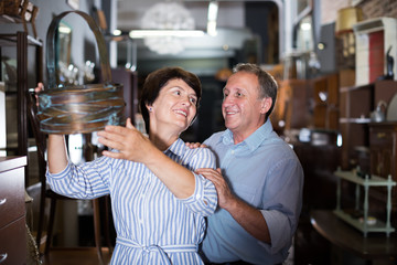 Couple is shopping in the antique store