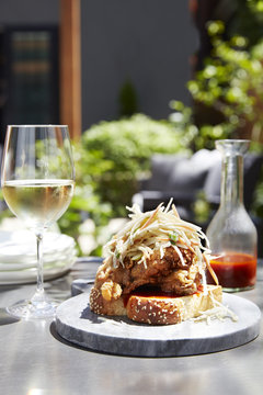 Open face fried chicken sandwich topped with cole slaw
