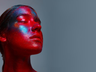 Bright neon make-up, creative body art on the theme of space and stars.Space fairy,woman and universe