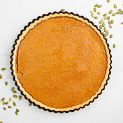 Pumpkin pie, tart. Grey stone background. Top view