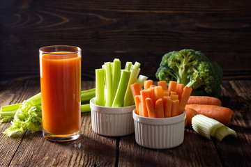 Healthy food - carrot juice, celery and broccoli.