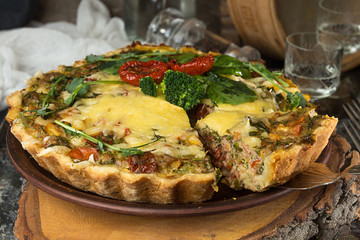 French opened pie quiche with tuna / chicken, broccoli, spinach, pepper, eggs, cheese and dried tomato.