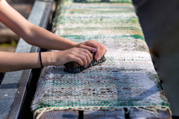 Traditional summer rug washing in Finland