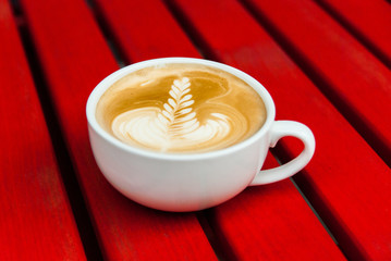 Close up of the coffee on the red table