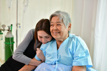 Patient Concept. Grandma's in the hospital. Waiting for someone to visit. Grandchildren visit grandma at the hospital. Grandma is happy to meet grandchildren.