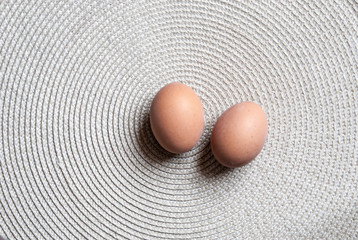 Two eggs on light background