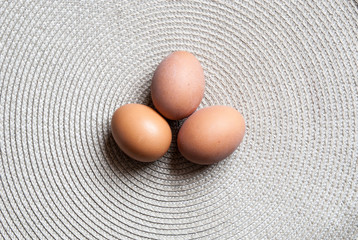 Three organic eggs