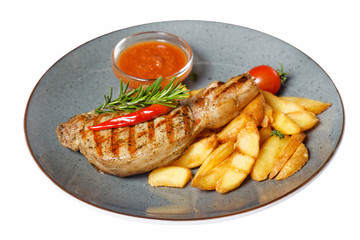 fried meat with garnish of potatoes isolated on white background