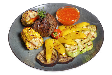 grilled meat with garnish of vegetables