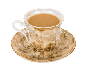 Coffee with milk in vintage porcelain cup and saucer