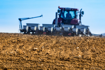 Fototapeta premium spring sowing in the field with modern mechanisms