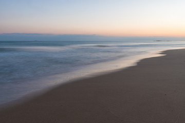 Fototapeta na wymiar Colorful sunset sky and sea with blurred motion.