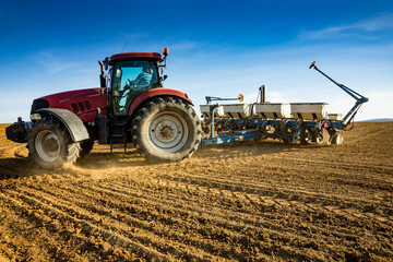 Obraz premium spring sowing in the field with modern mechanisms
