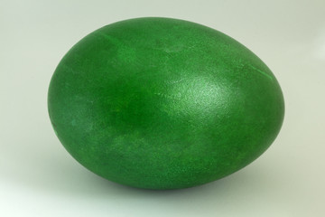 Theme Easter. Close-up of a duck egg colored in green.