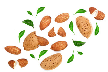 almonds decorated with leaves isolated on white background. Top view. Flat lay pattern