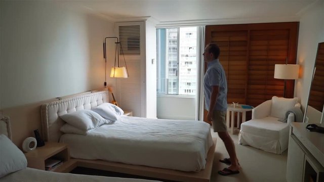 Professional video of man jumping on the bed in slow motion 180fps