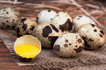 Naklejka na ściany i meble quail eggs on wooden background