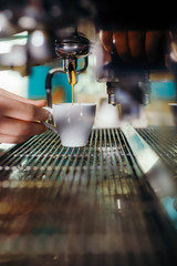 Man Preparing Coffee at Coffee Machine