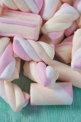 marshmallow on turquoise wooden surface