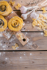 Raw homemade pasta with flour, garlic and spices