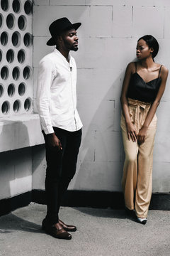 Lovely african newlyweds softly holding each other and smilling.