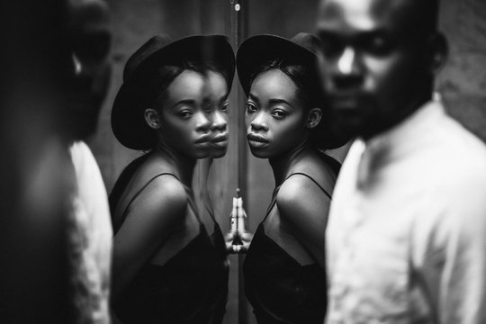 Modern black man and caucasian woman in a town.