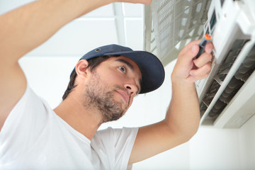 Man repairing air conditioner