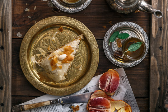 Traditional moroccan copper plate with piece of pie
