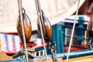 Wandaufkleber Vintage and retro details of old sailing boats during a Sail event along the quay © fotografiecor