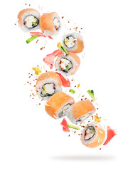 Pieces of sushi frozen in the air in high resolution, isolated on white background