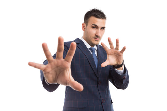 Young businessman or sales man with defensive gesturing.