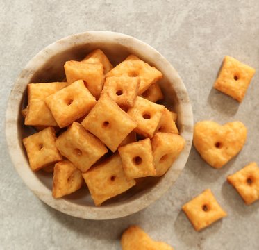 Homemade square Cheese Crackers in a bowl