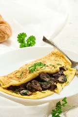 Homemade fluffy Mushroom Omelette garnished with Chives , selective focus