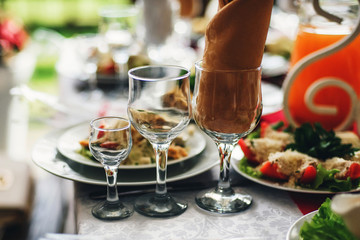 drinks glasses and food on the table in the restaurant on the festive table for a party