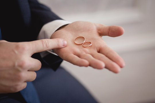Wedding rings on Groom's hands. Preparing to wedding day