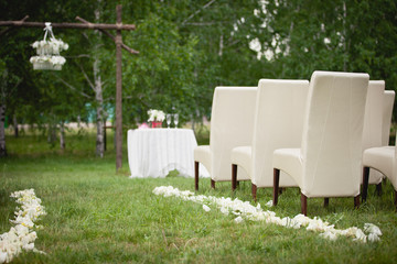 Wedding set up in a garden. Wedding ceremony & Wedding decorations/Wedding Archway/Wedding Archway with white petals