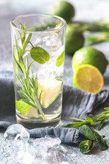 Glass of lime water with herbs