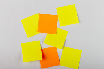 Mock-up lot of yellow empty office stickers on white background